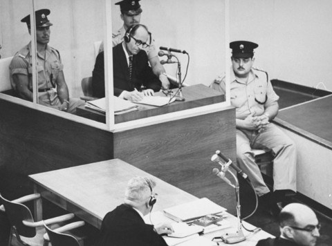 Adolf_Eichmann_takes_notes_during_his_trial_USHMM_65268.jpg